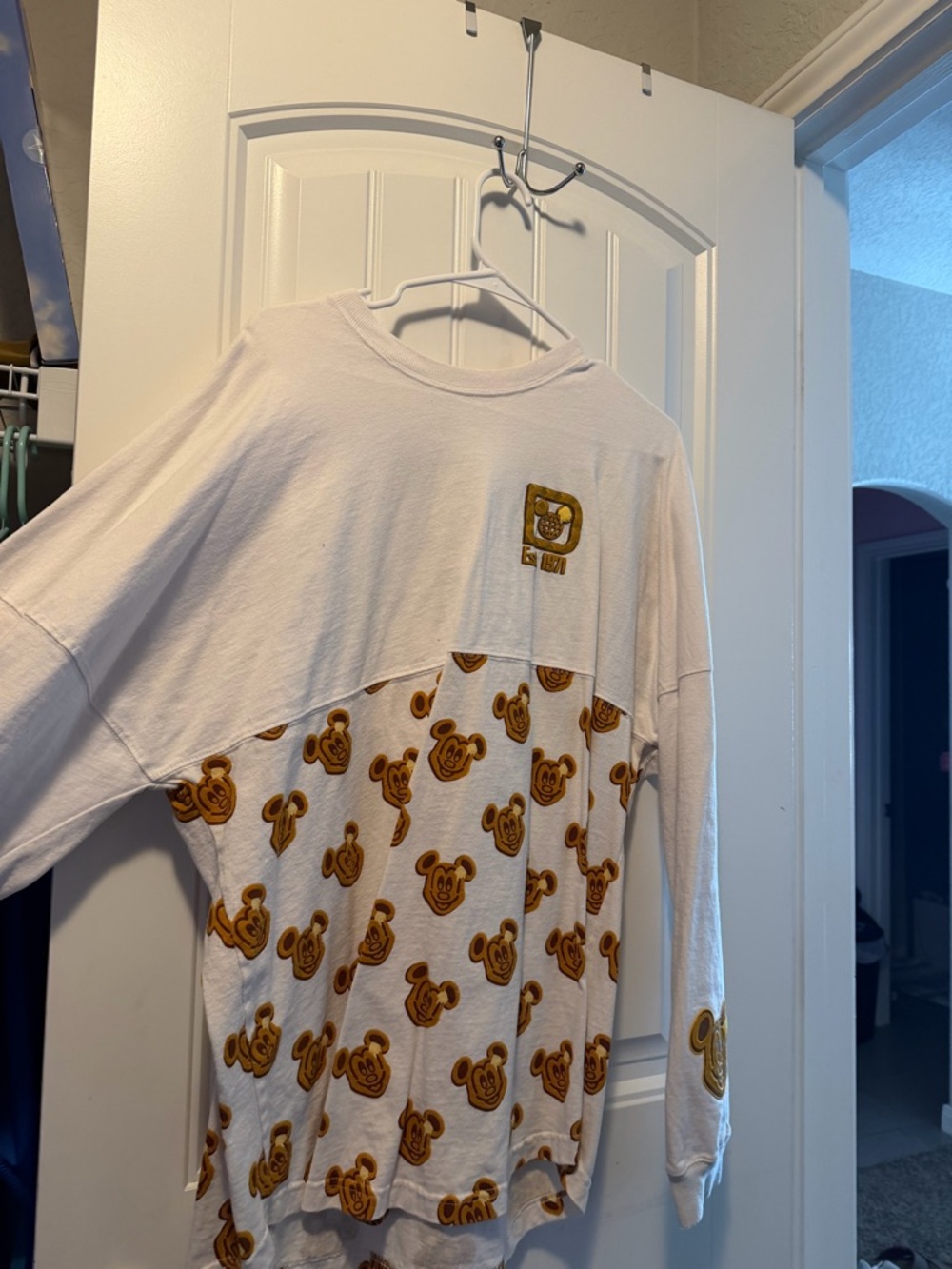 White Long-Sleeve Graphic Top with Golden Bear Print